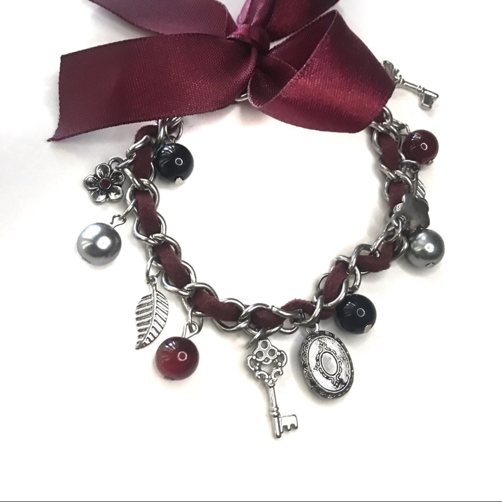 Maroon charm bracelet with bow